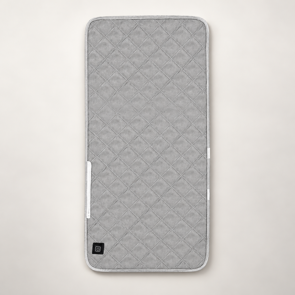 Cuscino riscaldante USB ORVO 45 × 90 cm visto dall’alto, con tasto di accensione in basso